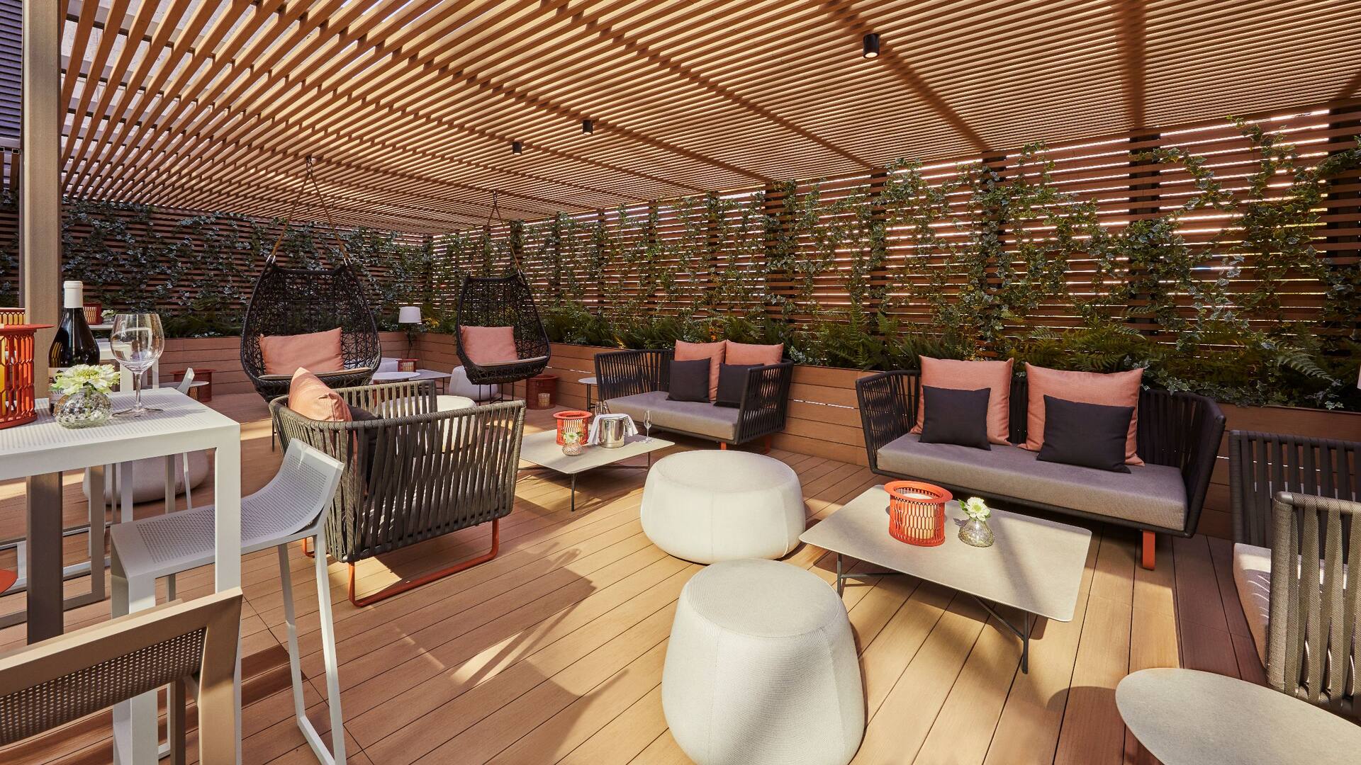 Axis Lounge outdoor terrace with wooden ceiling and comfortable seating at Hyatt Regency Barcelona Tower