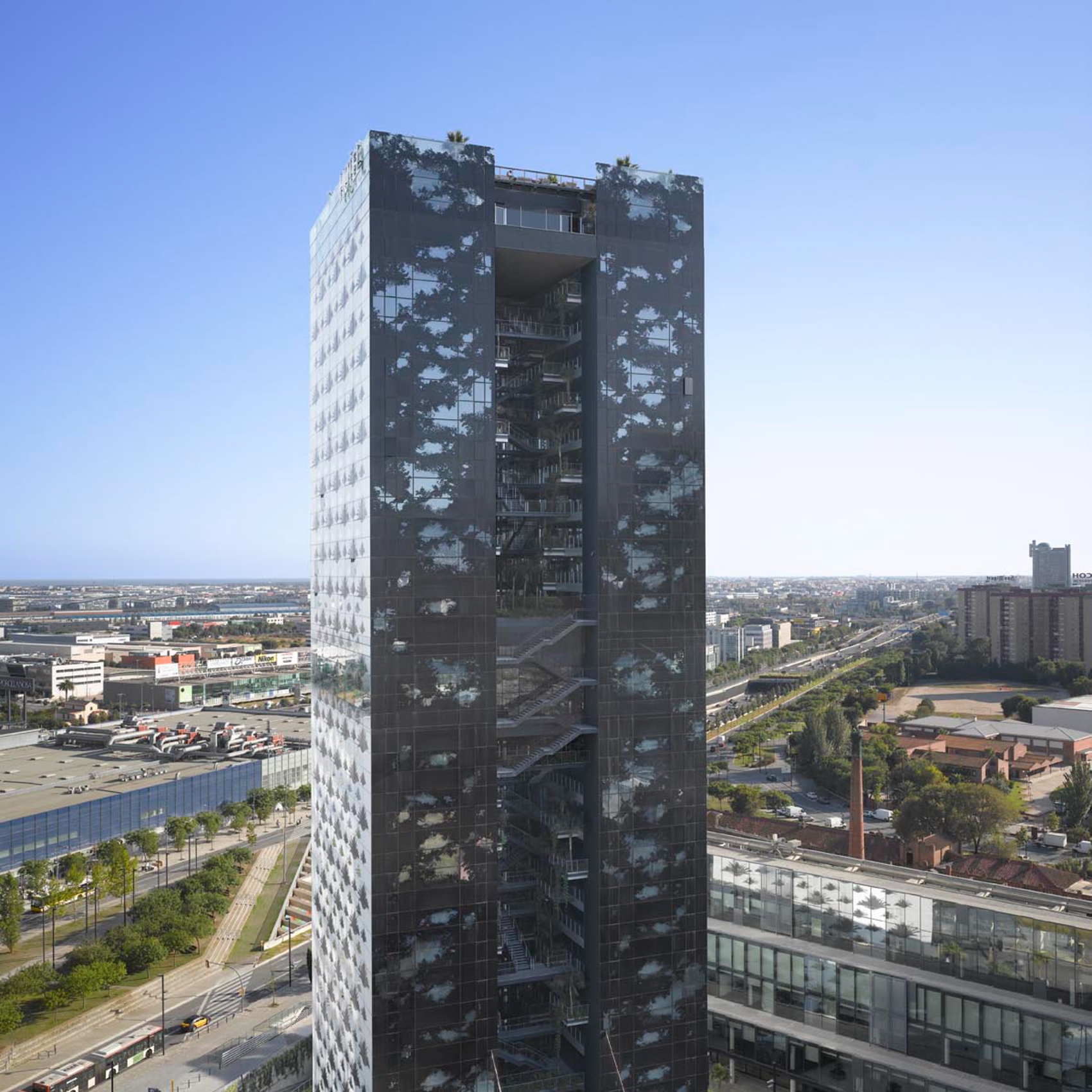 The distinctive twin towers and vertical gardens of Renaissance Barcelona Fira Hotel